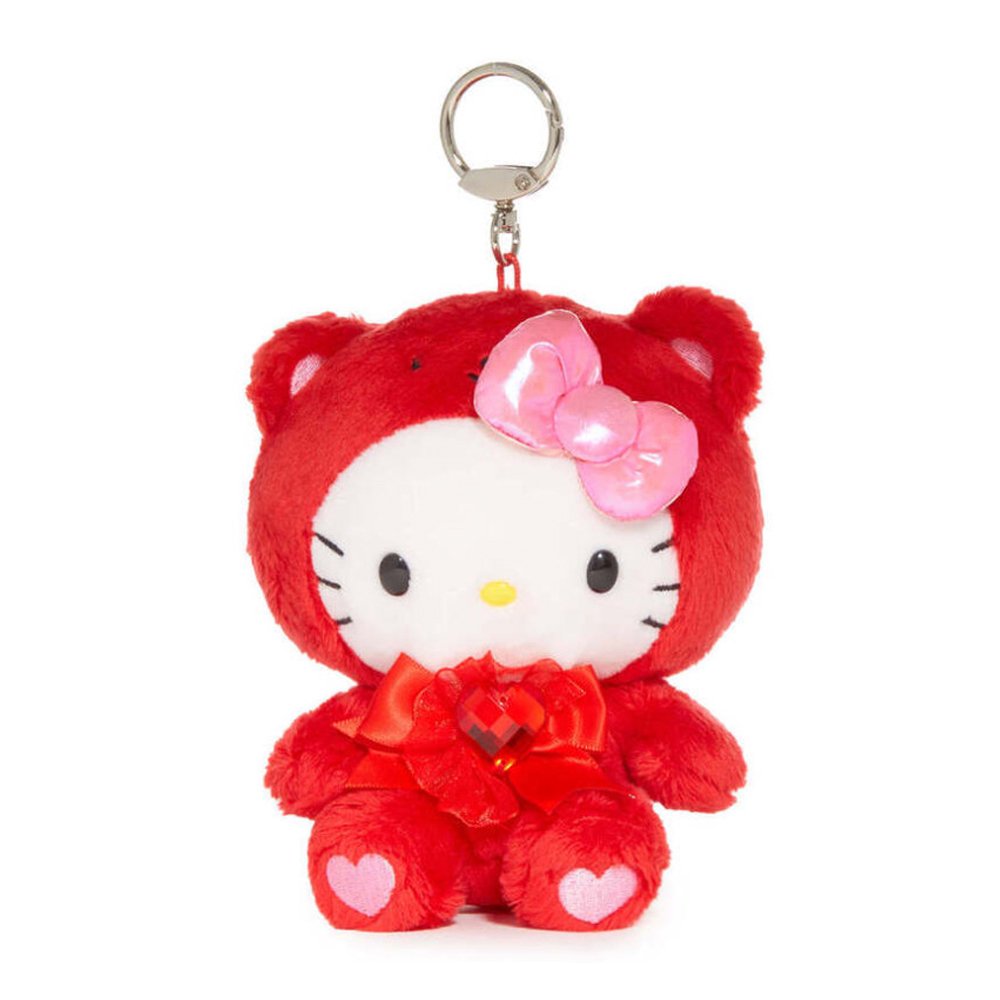 An officially licensed Sanrio Hello Kitty January birthstone plush keychain clip wearing a red garnet-themed hood, a pink bow, and a red ribbon with a heart gem.