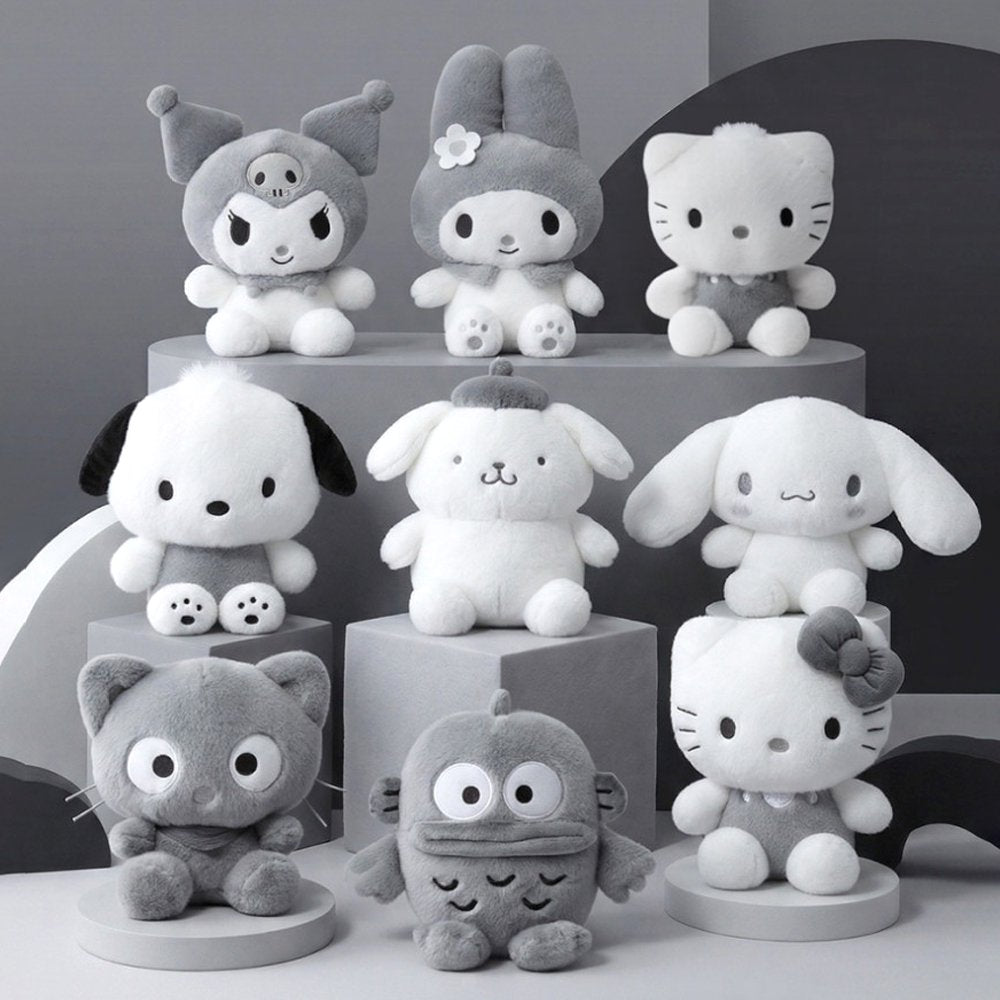 An officially licensed Sanrio Hello Kitty, Dear Daniel, My Melody, Cinnamoroll, Kuromi, Pompompurin, Pochacco, Chococat, and Hangyodon plush dolls each dressed in their iconic outfits in monochrom white and gray color