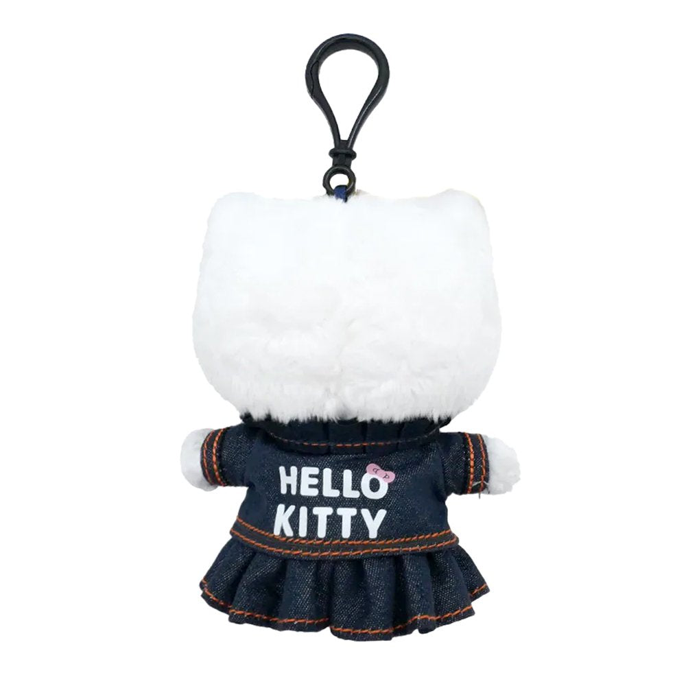 Officially licensed Sanrio Hello Kitty plush keychain wearing a dark-wash denim jacket and pleated skirt with high-contrast orange stitching and a matching denim bow