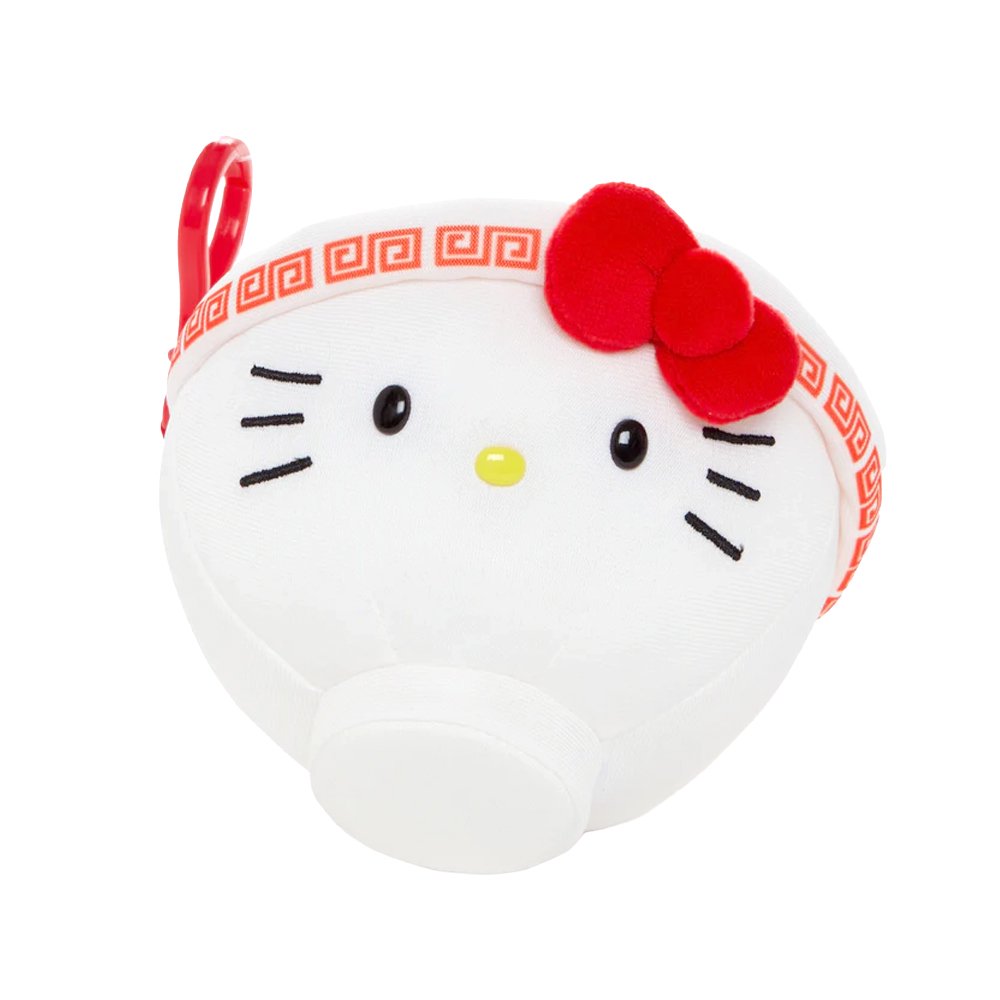 An officially licensed Sanrio plush keychain shaped like a white ramen bowl with Hello Kitty's face and a red bow. The top view shows a printed design of ramen noodles, green onions, and a Hello Kitty-themed egg.