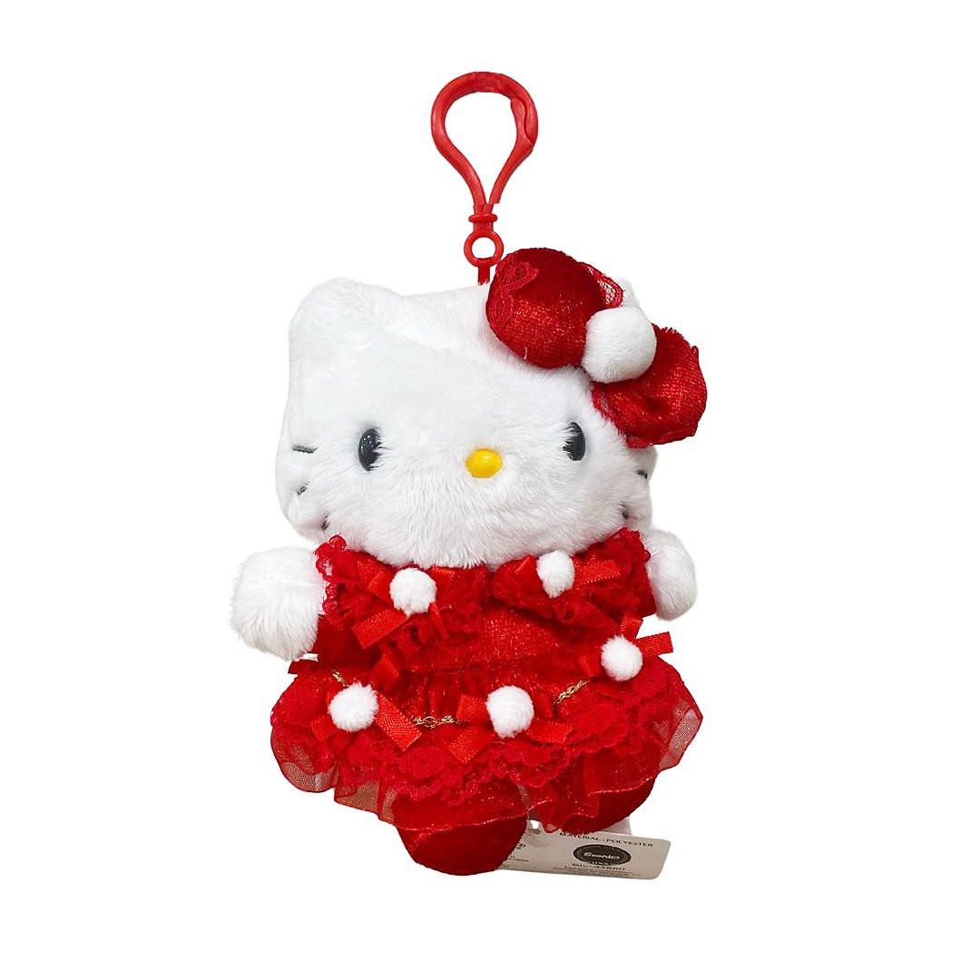 Officially licensed by Hello Kitty Plush keychain in a red dress with white accent pompom on a white background. she’s perfect for cuddling, displaying, or gifting Christmas to Sanrio fans of all ages.