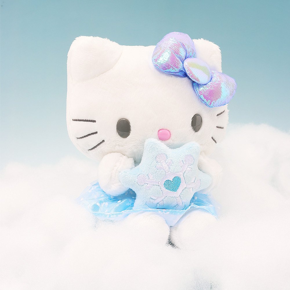 Magical Hello Kitty Snow Angel plush sitting on soft clouds against a light blue background, creating a serene winter scene