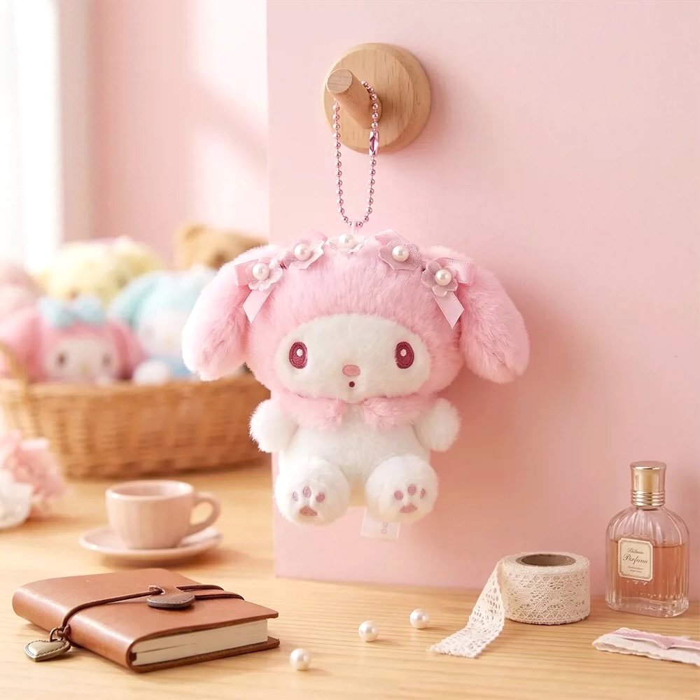 Officially licensed Sanrio My Melody pink tone plush keychain styled in dreamy pastel pink and soft white hues with color-matched embroidered features, dangling from a ball chain