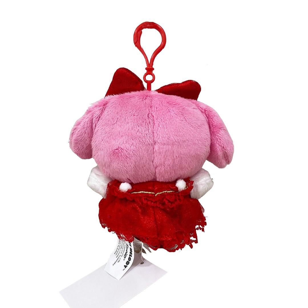 Officially licensed by My Melody Plush keychain in a red dress with white accent pompom on a white background. she’s perfect for cuddling, displaying, or gifting Christmas to Sanrio fans of all ages.