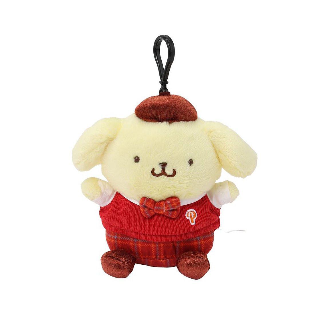 Officially licensed Pompompurin bag clip plush doll wearing a in a school uniform. He wears a red knitted sweater vest, a plaid bow tie, matching plaid shorts, and a brown beret hat. Perfect size to attach to your backpack, bag, purse, car, or pants. Ideal collectible toy for fans and Sanrio enthusiasts.