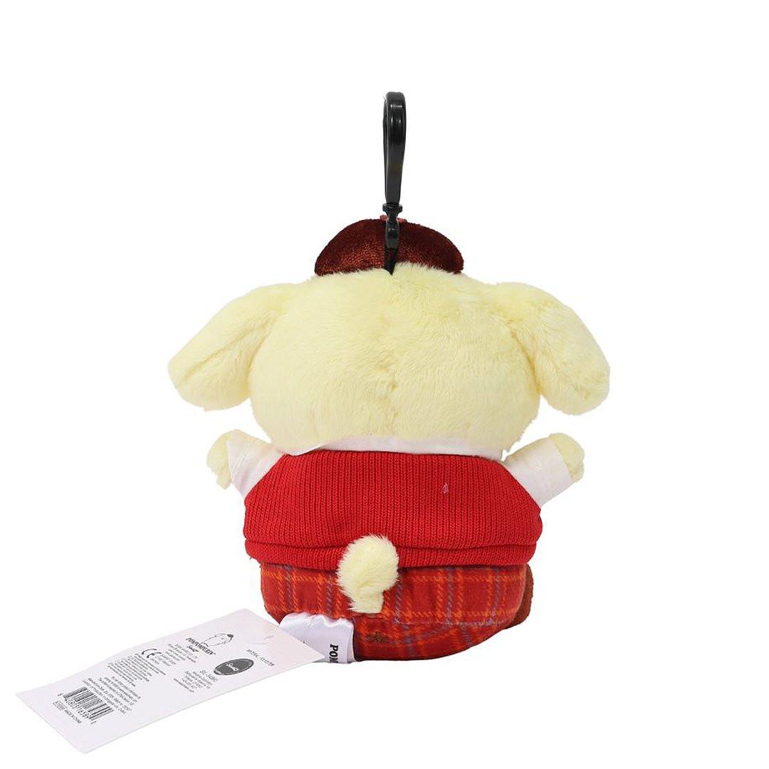 Officially licensed Pompompurin bag clip plush doll wearing a in a school uniform. He wears a red knitted sweater vest, a plaid bow tie, matching plaid shorts, and a brown beret hat. Perfect size to attach to your backpack, bag, purse, car, or pants. Ideal collectible toy for fans and Sanrio enthusiasts.