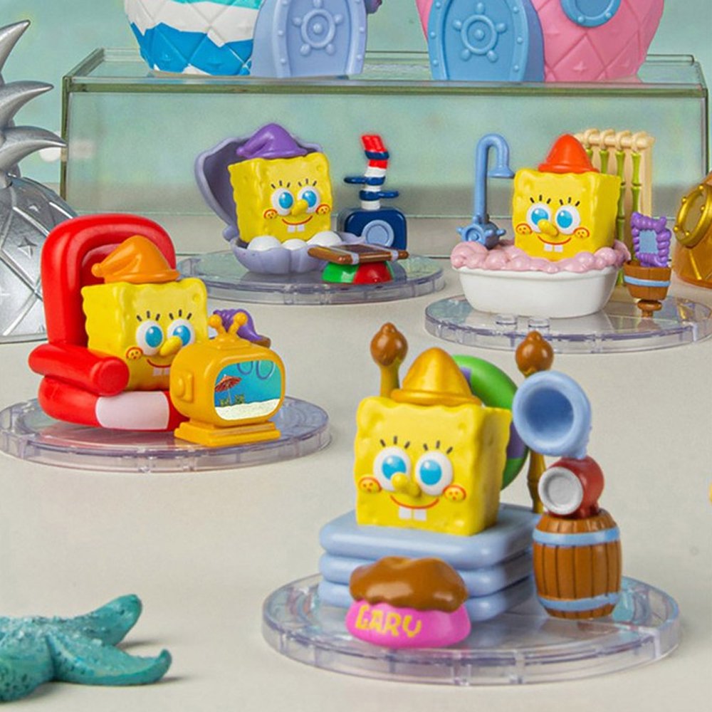 An officially collection of SpongeBob SquarePants "Home Sweet Pineapple" blind box figures in various colors, the pineapple exterior lifts to showcase a multi-level interior room