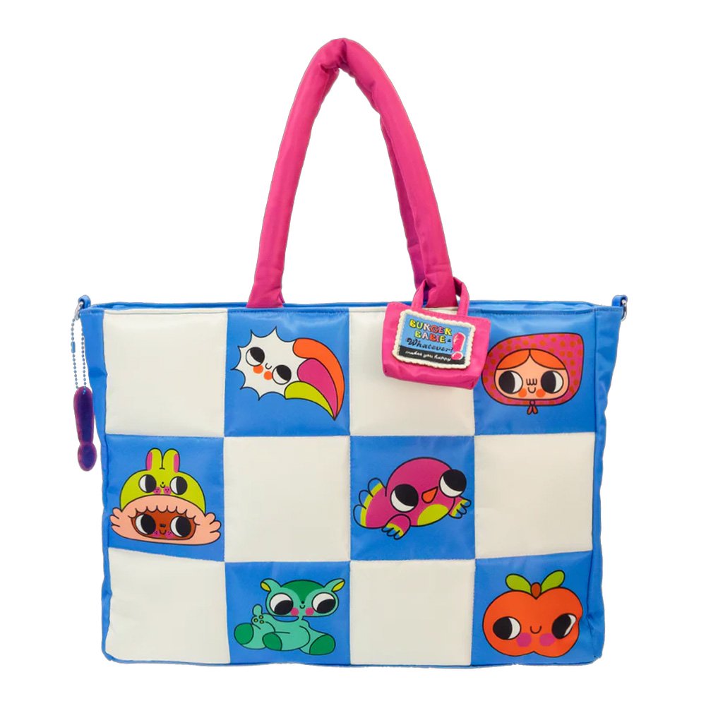 An officially licensed Burger Bargie large blue tote bag featuring a character's face with large eyes and a smile. The bag has bright pink padded handles and is decorated with small patches above the character's hair line.