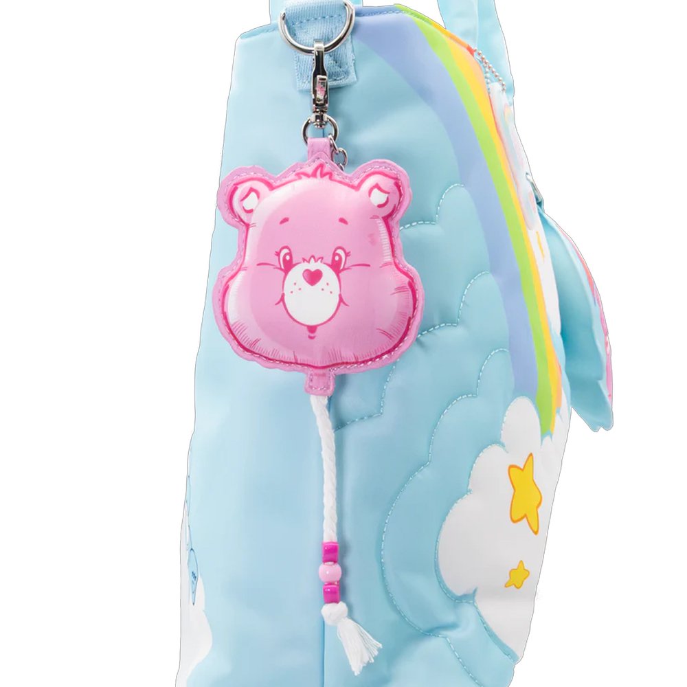 An officially licensed collection of six Care Bears face balloon-shaped mystery coin bag charm keychains in various colors