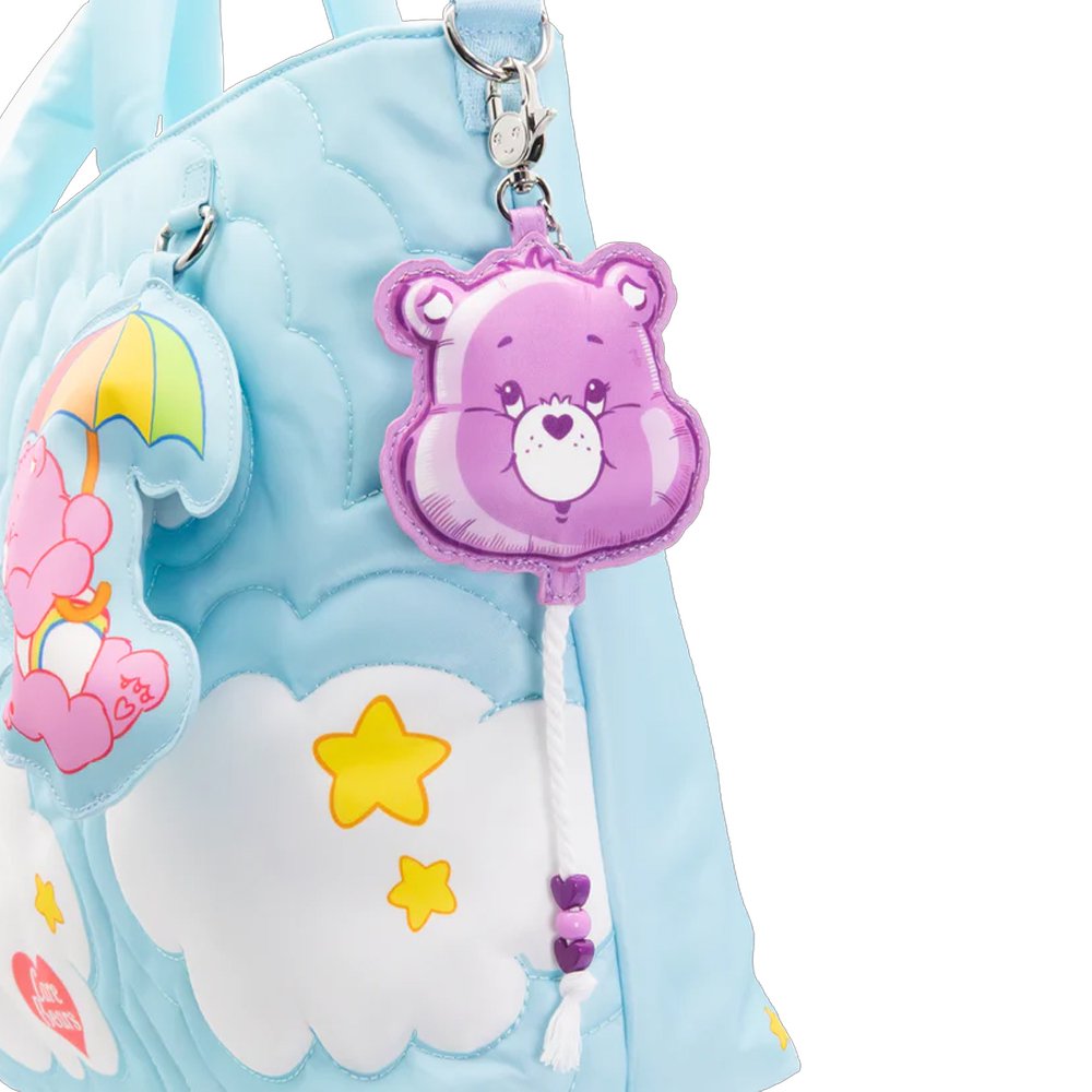 An officially licensed collection of six Care Bears face balloon-shaped mystery coin bag charm keychains in various colors