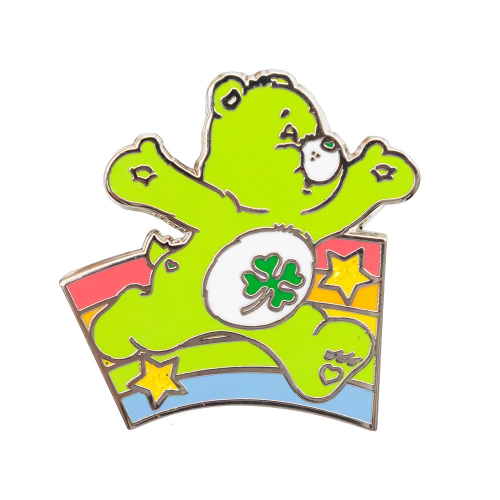 An officially licensed collection of six connecting Care Bears enamel pins forming a colorful rainbow bridge, featuring a Grumpy Bear pin with hanging raindrop charms