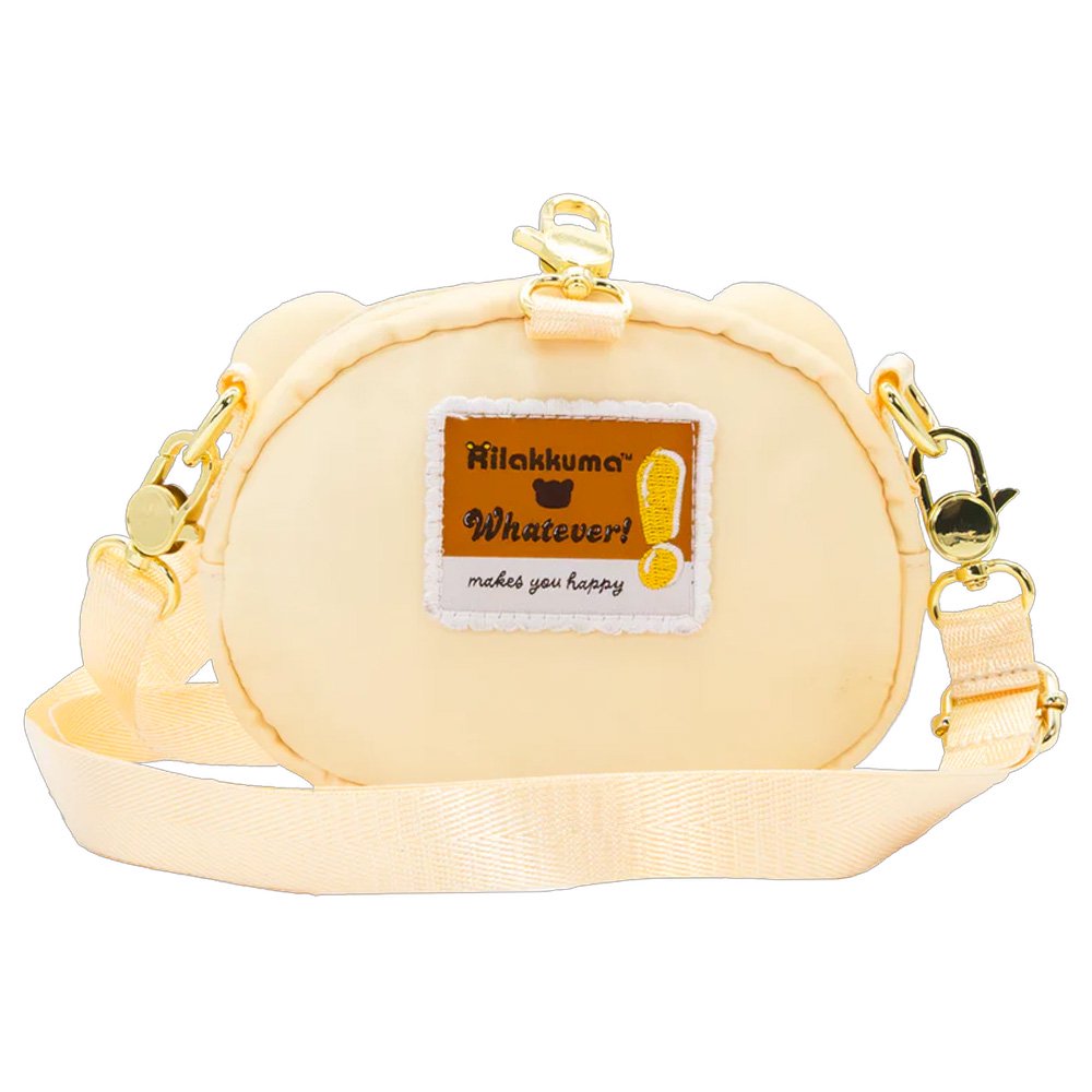 An officially licensed Korilakkuma puffy crossbody bag in an ivory color, shaped like the character's head with round ears. The bag includes a detachable ivory shoulder strap with gold-tone hardware.