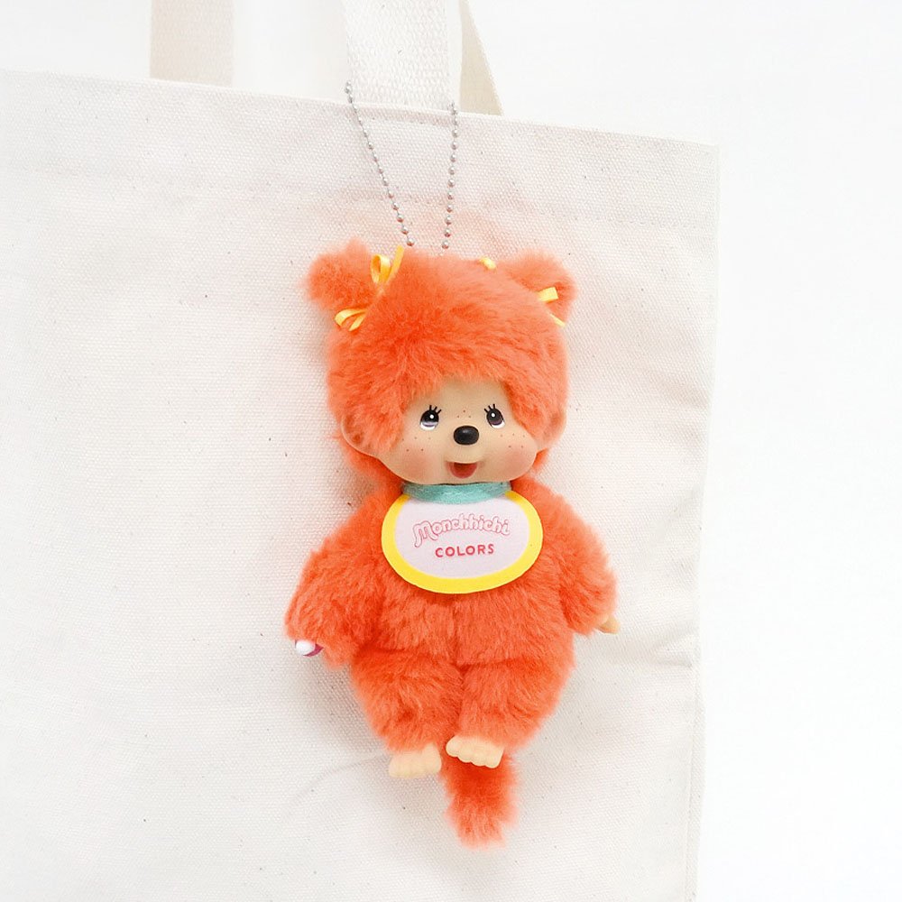 Monchhichi Plush toy fox with a colorful tag on a white background