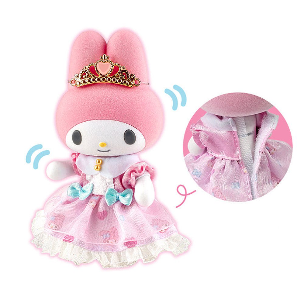 Sanrio My Melody Flocky Doll, a plush toy with intricate lace details, a removable outfit, and a sparkling tiara. The doll is pink with white and blue accents and is posed in a sitting position