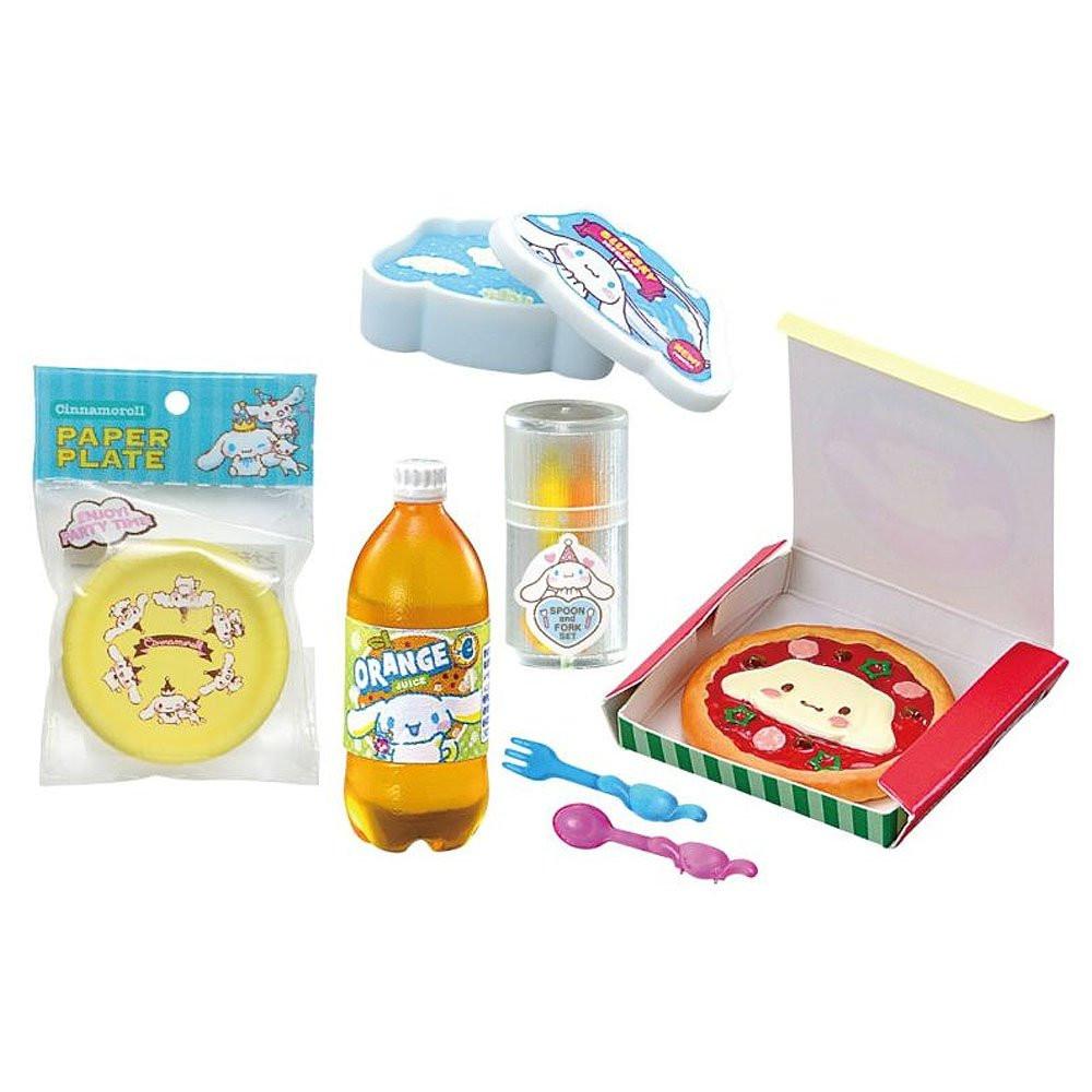 Collection of Cinnamoroll children's items including a paper plate, orange juice bottle, and toy pizza box on a white background.