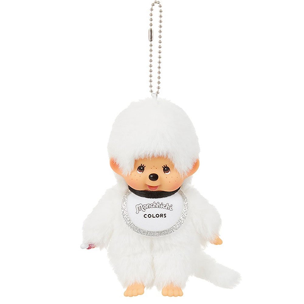 Plush keychain of a character in a white outfit with 'Monchhichi' branding on a white background