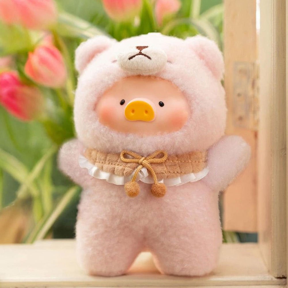Cute plush toy resembling a pig in a pink outfit with flowers in the background