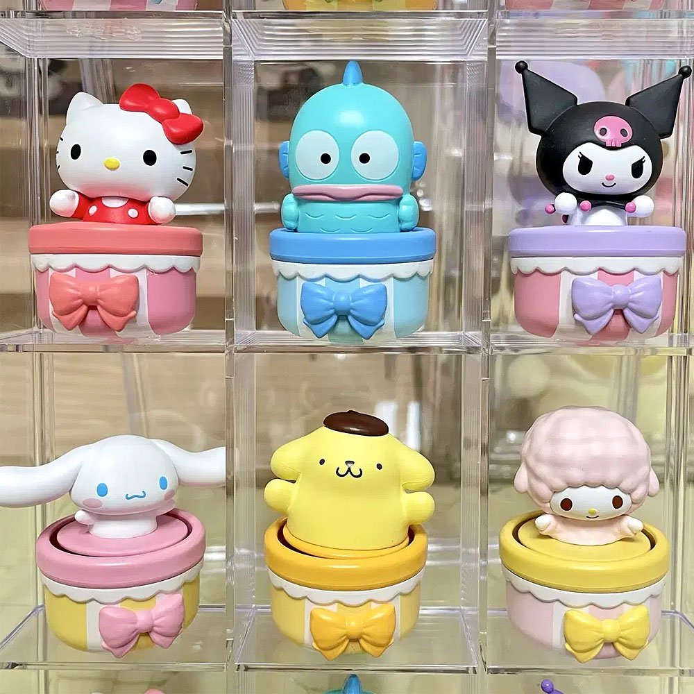 Set of colorful Sanrio character figurines in clear display cases.