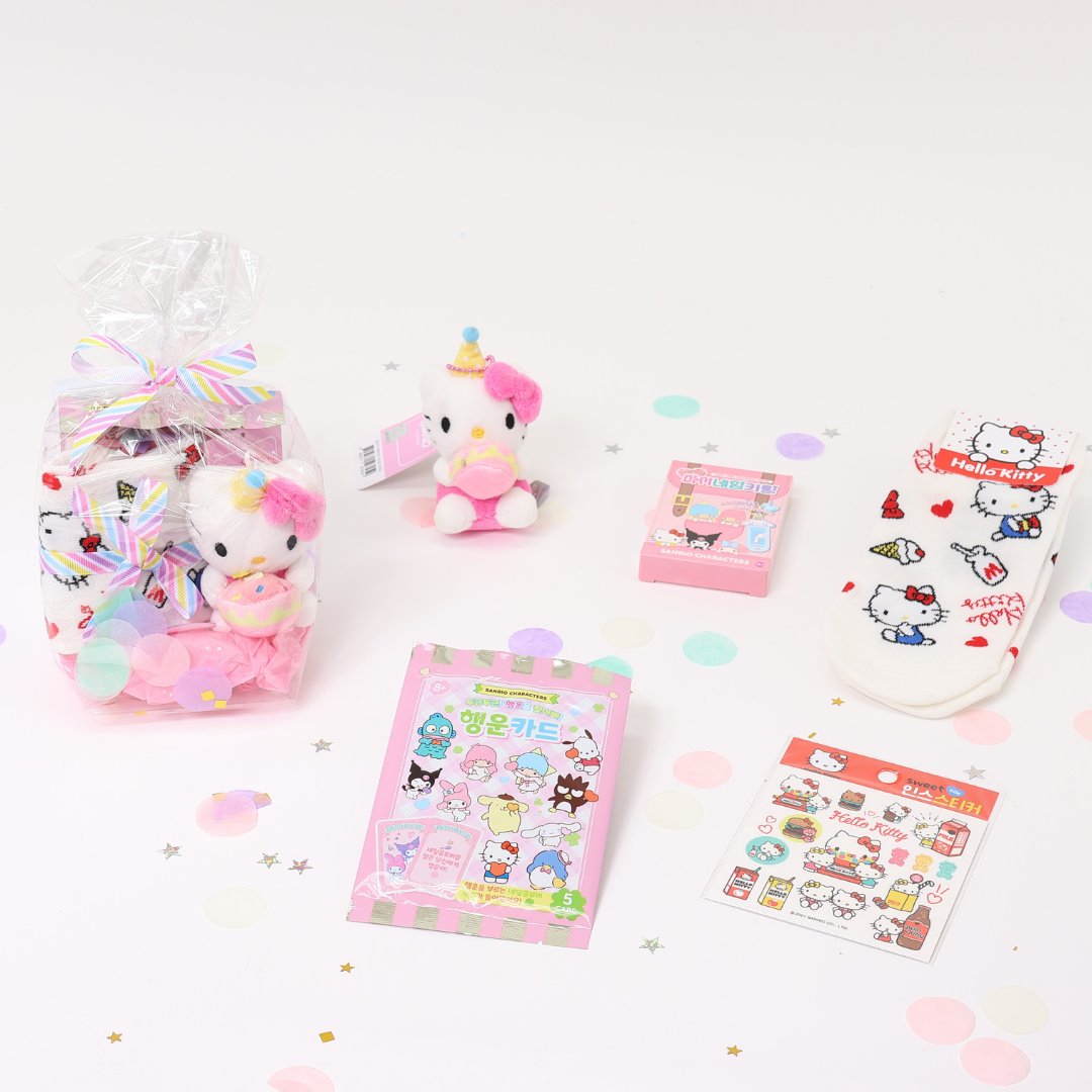 A collection of Sanrio Happy Birthday themed gift sets, each containing various colorful items such as plush keychains and socks, all packaged in clear gift bags with pink ribbons.