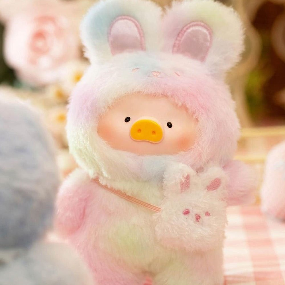 Plush toy with bunny ears and a colorful body