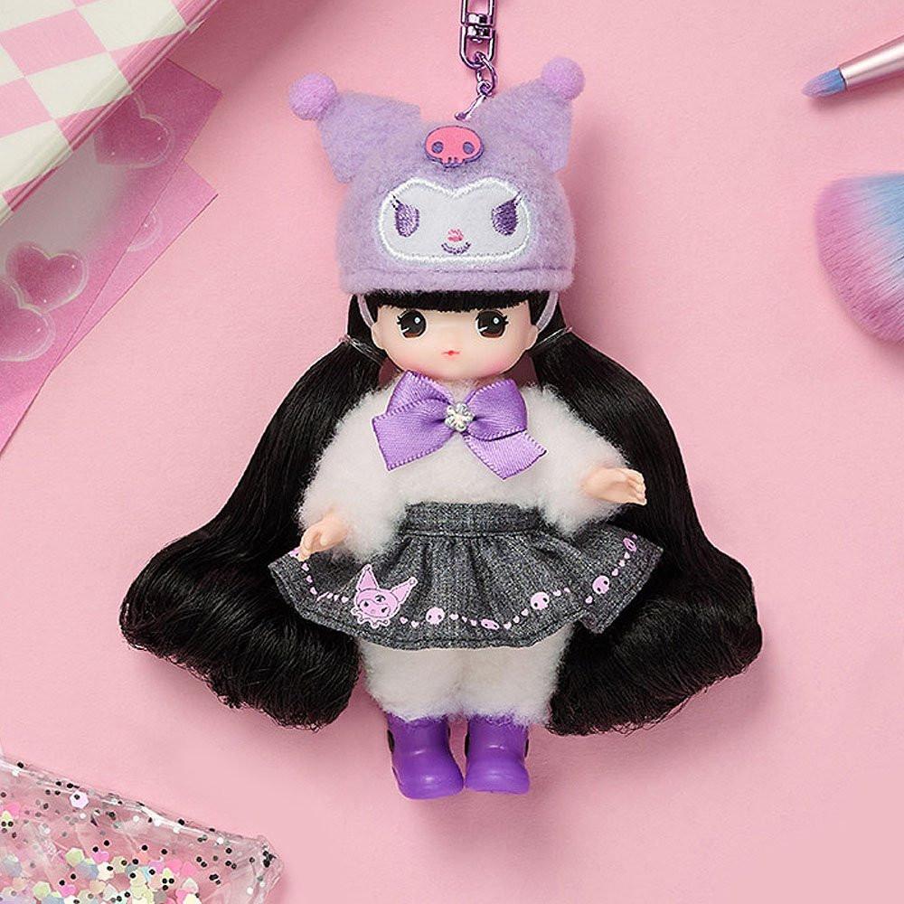 Little mimi x Kuromi doll with long black hair and a purple outfit, wearing a matching hat, on a pink background.