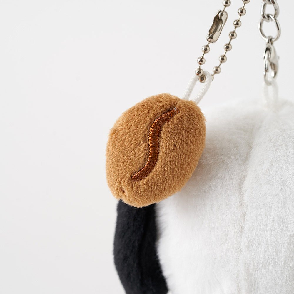 Snoopy Plush keychain shaped like a leaf with a chain on a white background