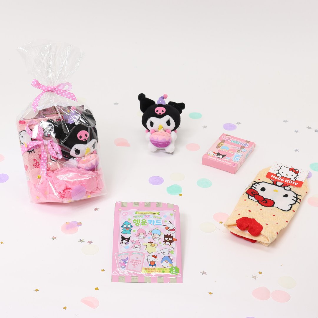 A collection of Sanrio Happy Birthday themed gift sets, each containing various colorful items such as plush keychains and socks, all packaged in clear gift bags with pink ribbons.