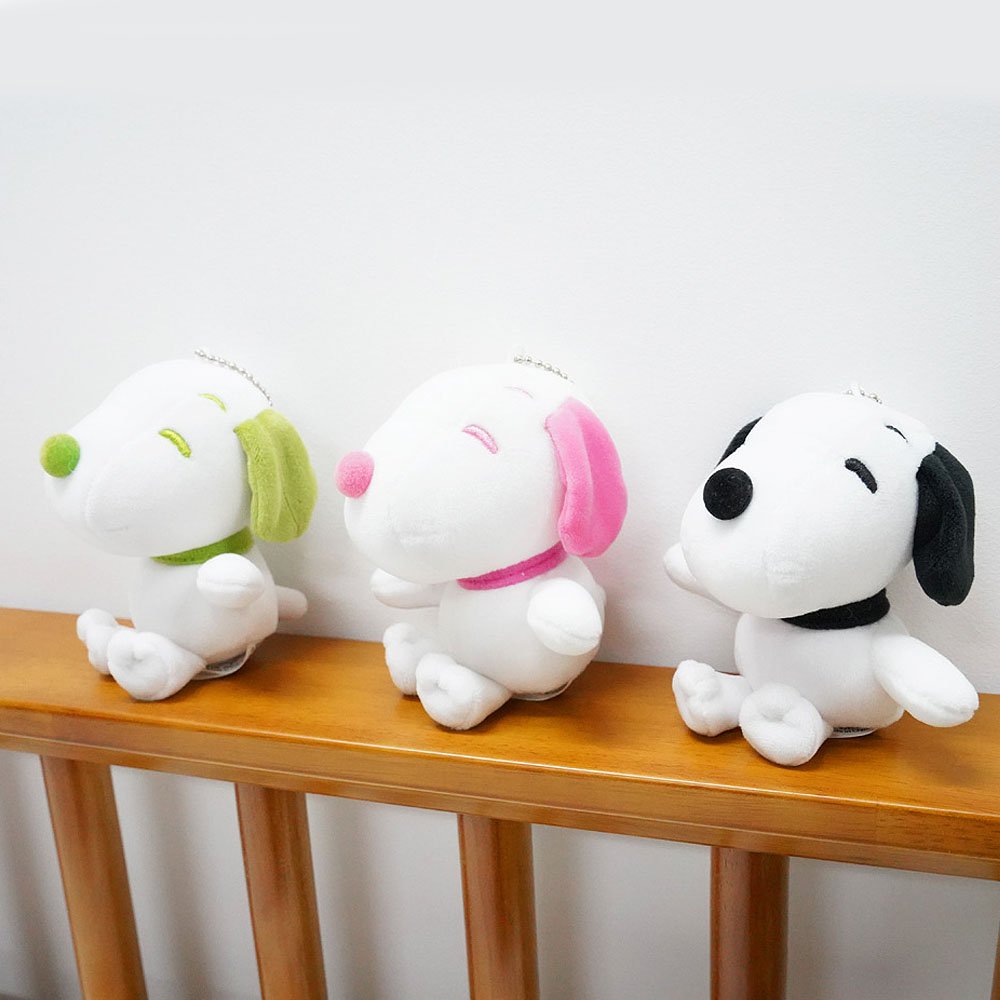 Peanuts Snoopy plushies in three colors displayed as cute bedroom decorations
