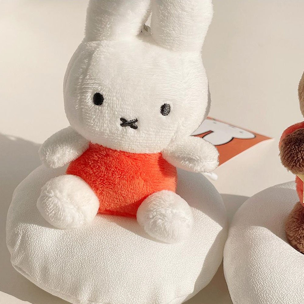 Two miffy is sitting on white clouds