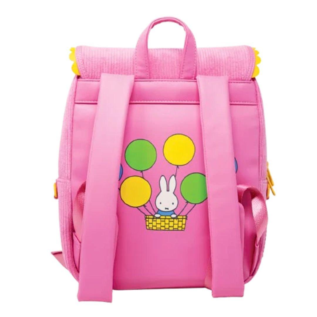 Officially licensed Miffy backpack in pink corduroy. The front features Miffy's face on a round clear window pocket, and the flap is shaped like bunny ears with yellow trim. The back has a graphic of Miffy riding in a hot air balloon with green and yellow balloons.