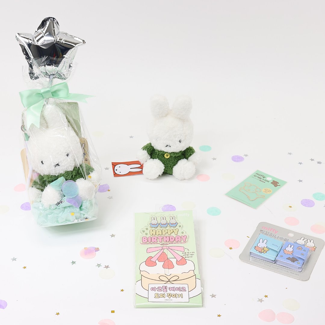 A collection of Miffy-themed birthday gifts including plush keychains, mini notebooks, metal deco stickers, a cake topper, and a letter set, all packaged with a 'Happy Birthday' theme.