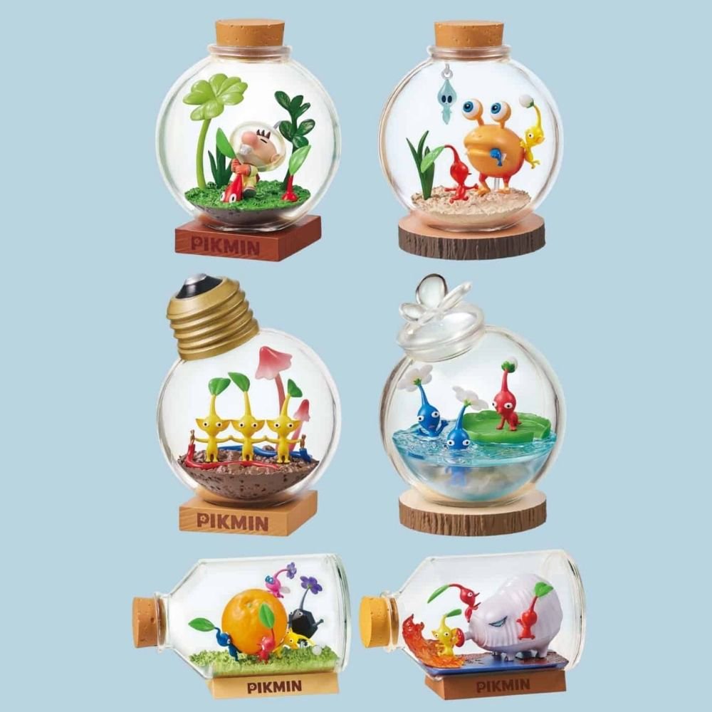 A complete set of six officially licensed Re-Ment Pikmin Terrarium Collection miniature figures. Displays all designs in their decorative clear containers (bottles, round glass, light bulb) resting on branded Pikmin wooden bases: designs featuring Captain Olimar, Red, Yellow, Blue, Rock, Winged Pikmin, and Bulborb creatures in various natural and fantasy diorama scenes