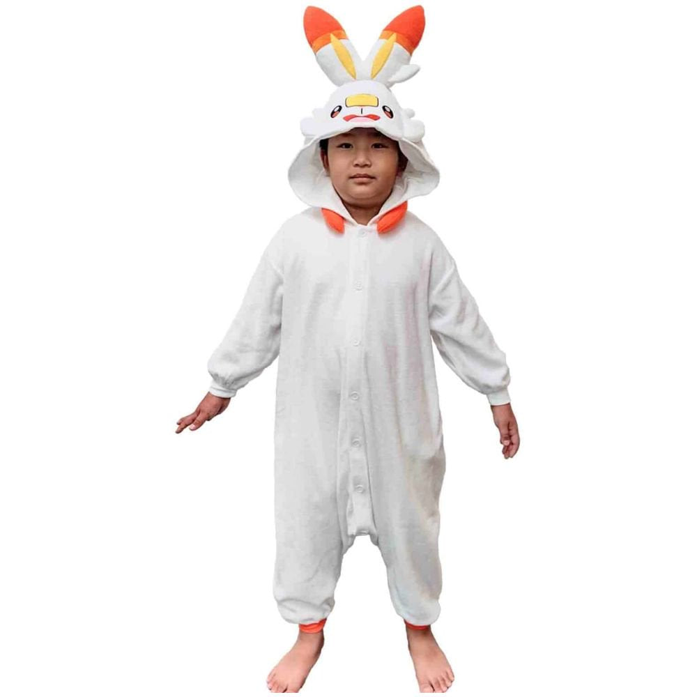 Young boy standing in Pokémon Scorbunny Kids Fleece Kigurumi Onesie Jumpsuit showing loose comfortable fit, ultra-warm white fleece children's Halloween party costume, winter pajamas and loungewear, ideal holiday present and warm Christmas sleepwear gift for kids