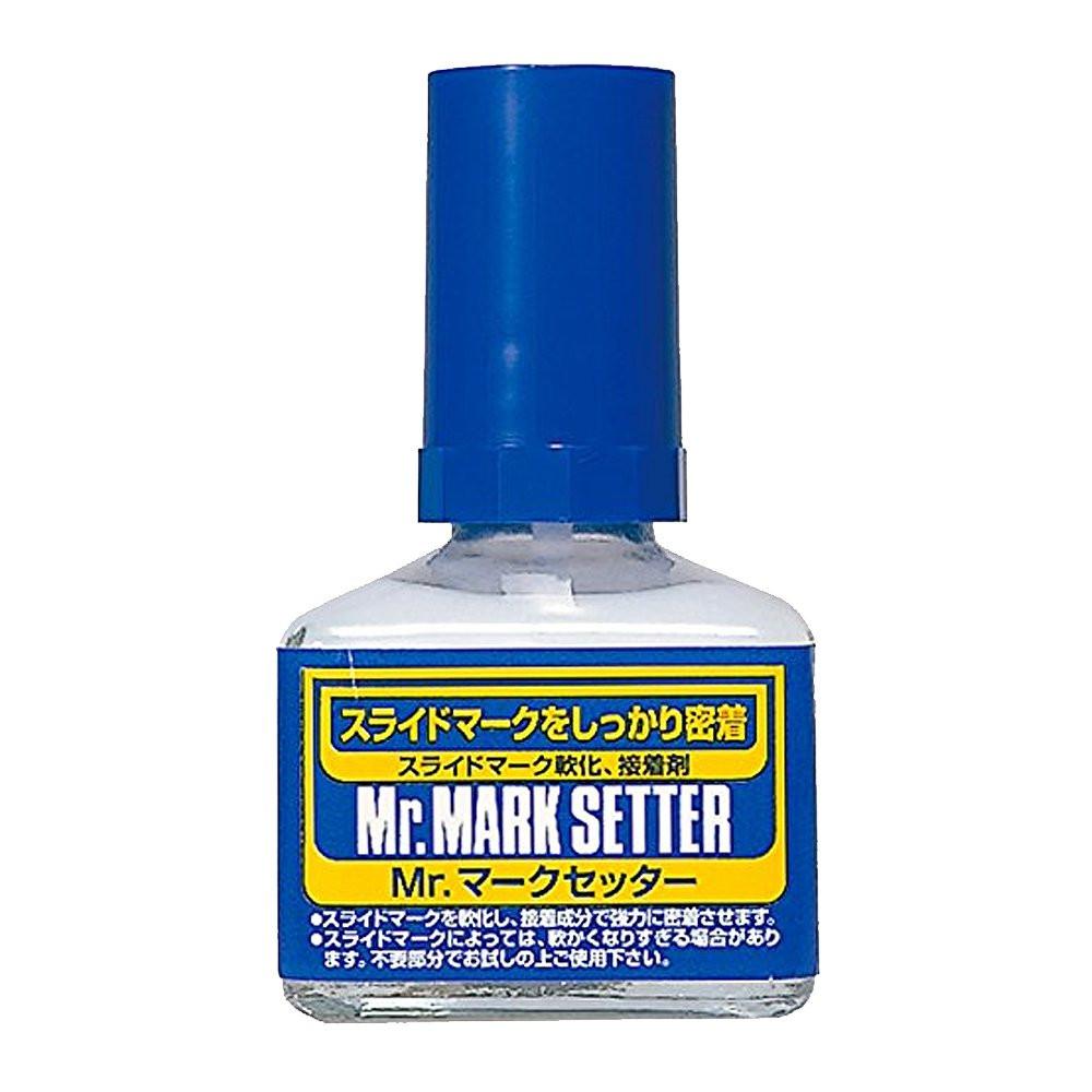 Bottle of Mr. Mark Setter with blue cap and label on a white background. Mark setter Use Mr. Mark Softer and Mr. Mark Setter to apply dry transfer decals.