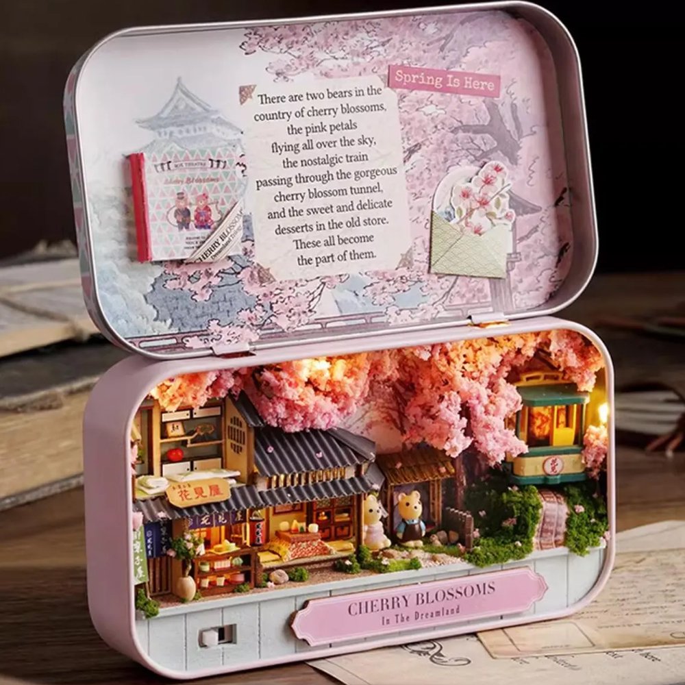 A intricate DIY miniature kit replicating a traditional Japanese tea room with shoji screens, a sake set, and a warm LED light