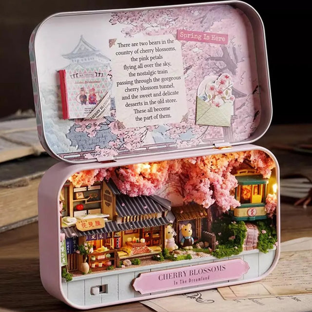 A intricate DIY miniature kit replicating a traditional Japanese tea room with shoji screens, a sake set, and a warm LED light
