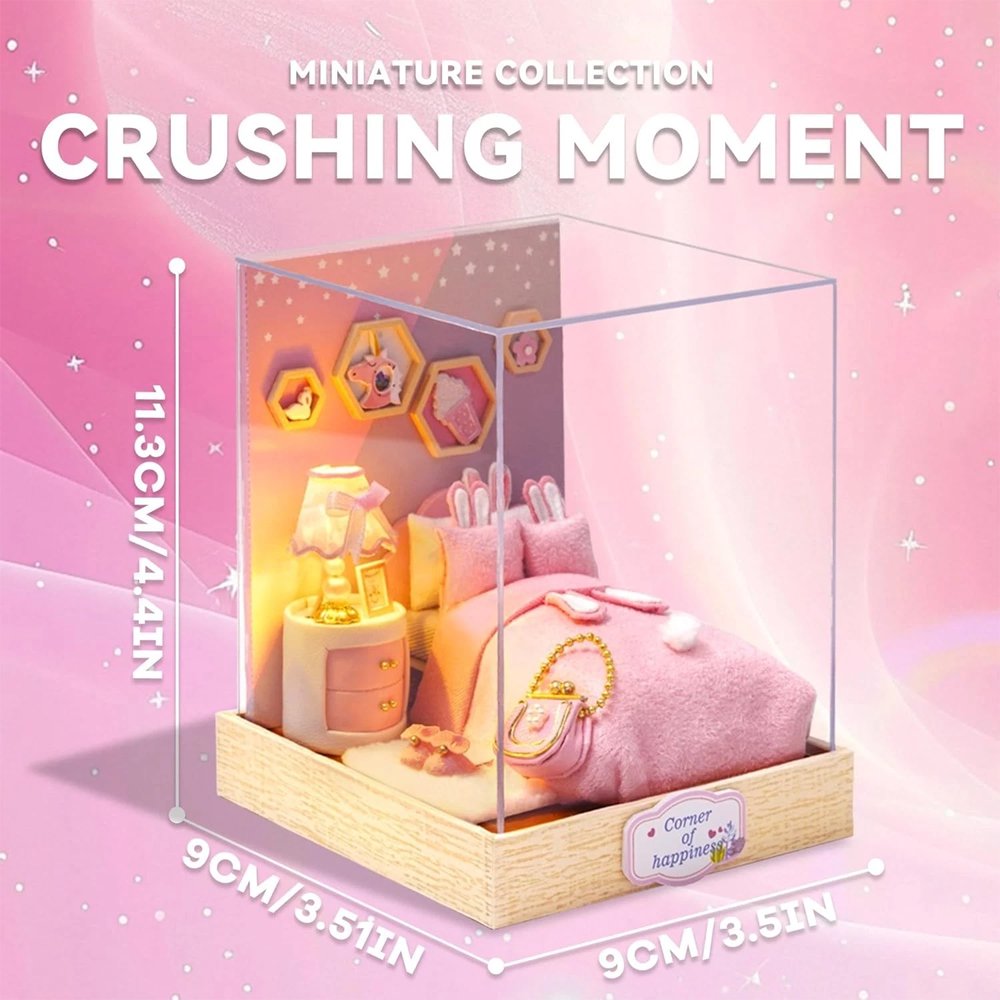 A whimsical DIY miniature bedroom featuring a plush pink bed with bunny pillows, a glowing bedside lamp, and starry wall decor