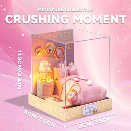 A whimsical DIY miniature bedroom featuring a plush pink bed with bunny pillows, a glowing bedside lamp, and starry wall decor