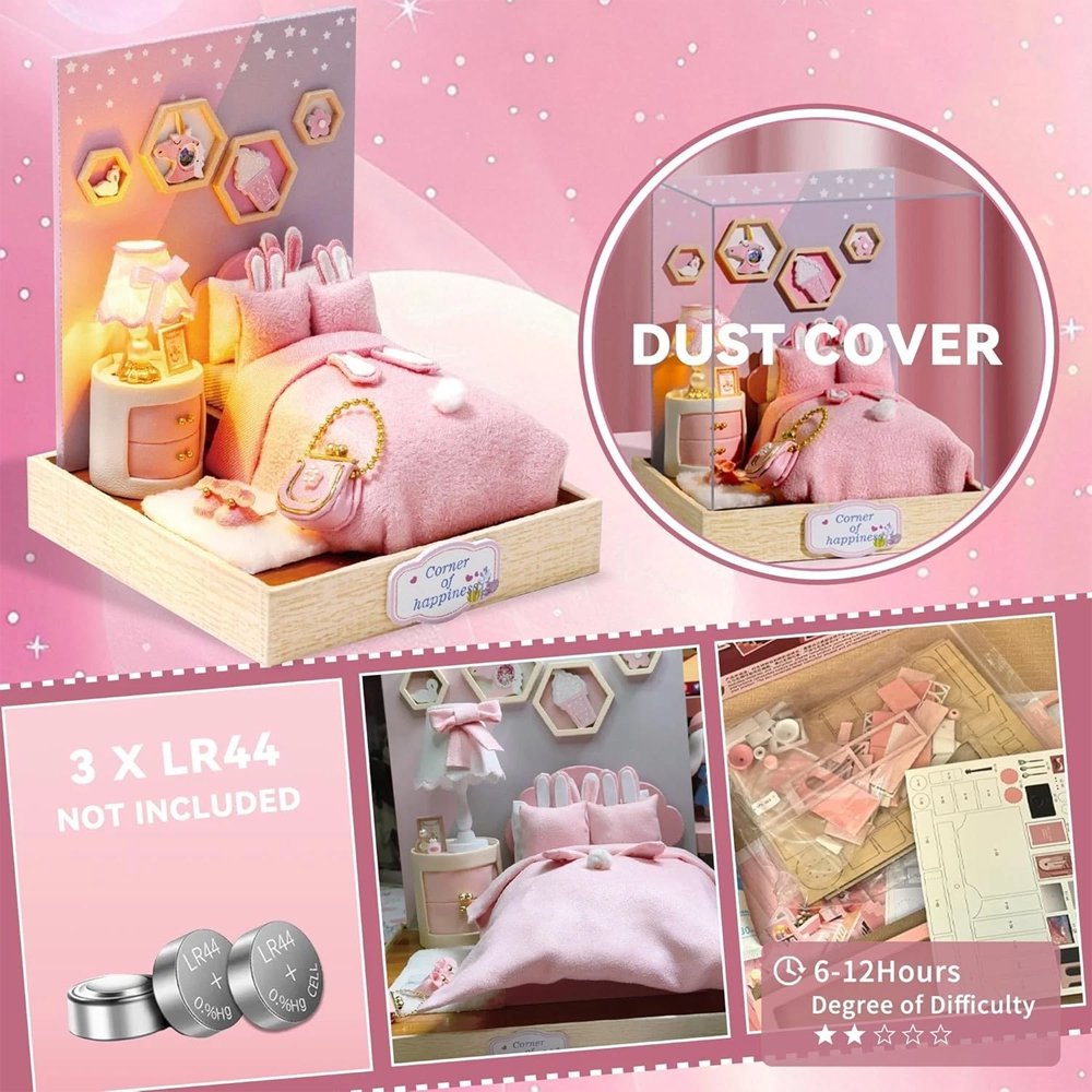 A whimsical DIY miniature bedroom featuring a plush pink bed with bunny pillows, a glowing bedside lamp, and starry wall decor