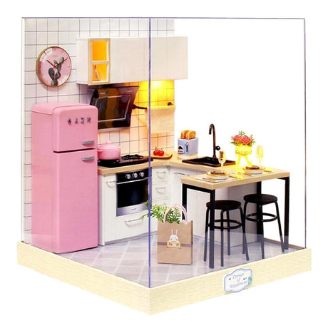 A detailed 3D DIY miniature kitchen model featuring a pink retro refrigerator, white cabinetry, and a small breakfast bar with stools