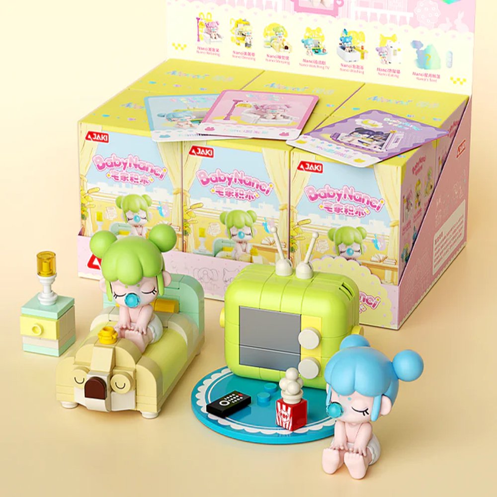 A collection of officially licensed building block sets featuring Baby Nanci in various home scenes like a bathtub, a bed, and next to a retro TV. The figures have colorful hair and are surrounded by pastel-colored furniture and accessories.