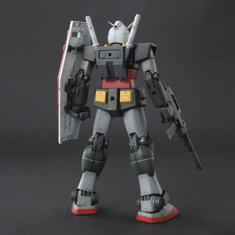 Bandai Master Grade MG 1/100 G-Armor RX-78 Gundam model kit box art showing a tactical support fighter next to an assembled Gundam figure in gray, red, and yellow Realtype colors holding a rifle and shield.