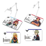 Two officially licensed Bandai Action Base 6 stands in clear plastic. Each features a rectangular base and an articulated support arm, customized with different plastic stickers showing portraits of characters like Suletta, Miorine, Guel, Shaddiq, and Elan.