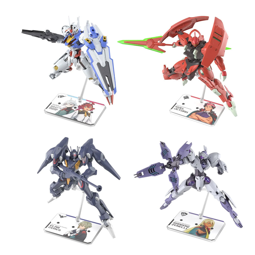 Two officially licensed Bandai Action Base 6 stands in clear plastic. Each features a rectangular base and an articulated support arm, customized with different plastic stickers showing portraits of characters like Suletta, Miorine, Guel, Shaddiq, and Elan.