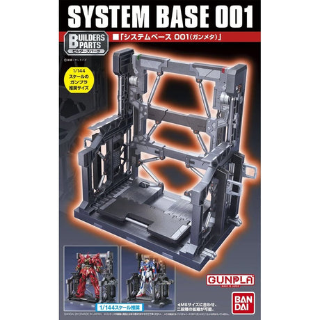 An officially licensed Bandai System Base 001 model kit display stand in metallic gunmetal gray. The retail packaging shows the mechanical hangar holding 1/144 scale Gunpla figures, highlighting its adjustable structural parts and industrial detail.
