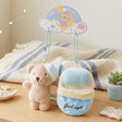 Bella Sweet Dream plush teddy bear wearing a blue nightcap tucked inside a cozy blue plush sleeping bag keychain set