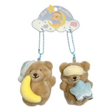 Pair of magnetic Bella Sweet Dream Moon & Star plush teddy bear keychains that stick together, featuring one bear holding a yellow crescent moon in a blue nightcap and another wearing a sleep mask with a blue star