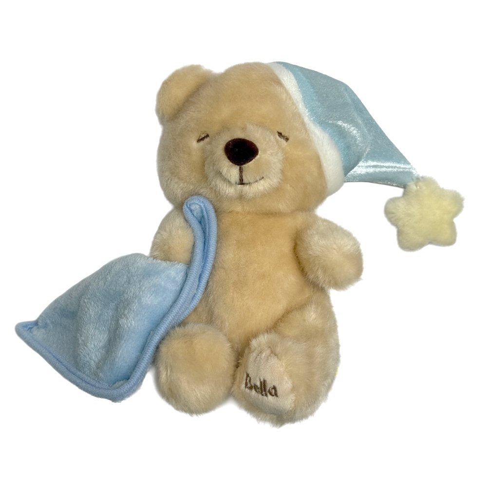 Bella Sweet Dream teddy bear plush toy wearing a blue nightcap with a star and holding a blue blankie with "Bella" embroidered on its foot