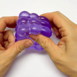 A close-up squeezing and molding of the Bubble jelly squeeze Squishy Toy. Demonstrating the ultra-soft, satisfyingly chewy jelly and mochi-like texture as a hand compresses the flexible ice block. Shows the high elasticity and slow-rising recovery of the embedded orange clownfish fidget, perfect for tactile stress relief, squishy ASMR satisfaction, and aesthetic sensory healing.