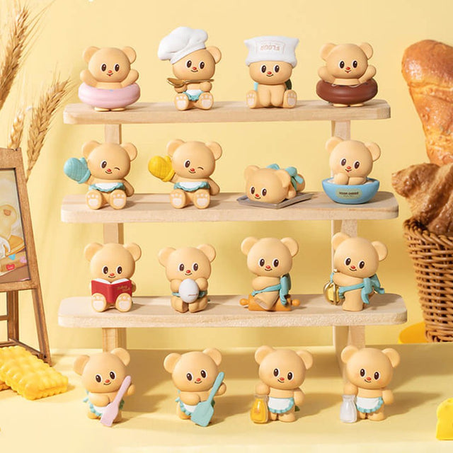 Officially licensed bakery-themed Butterbear collectible mini figures holding baking tools, wearing aprons, and posing with kitchen accessories
